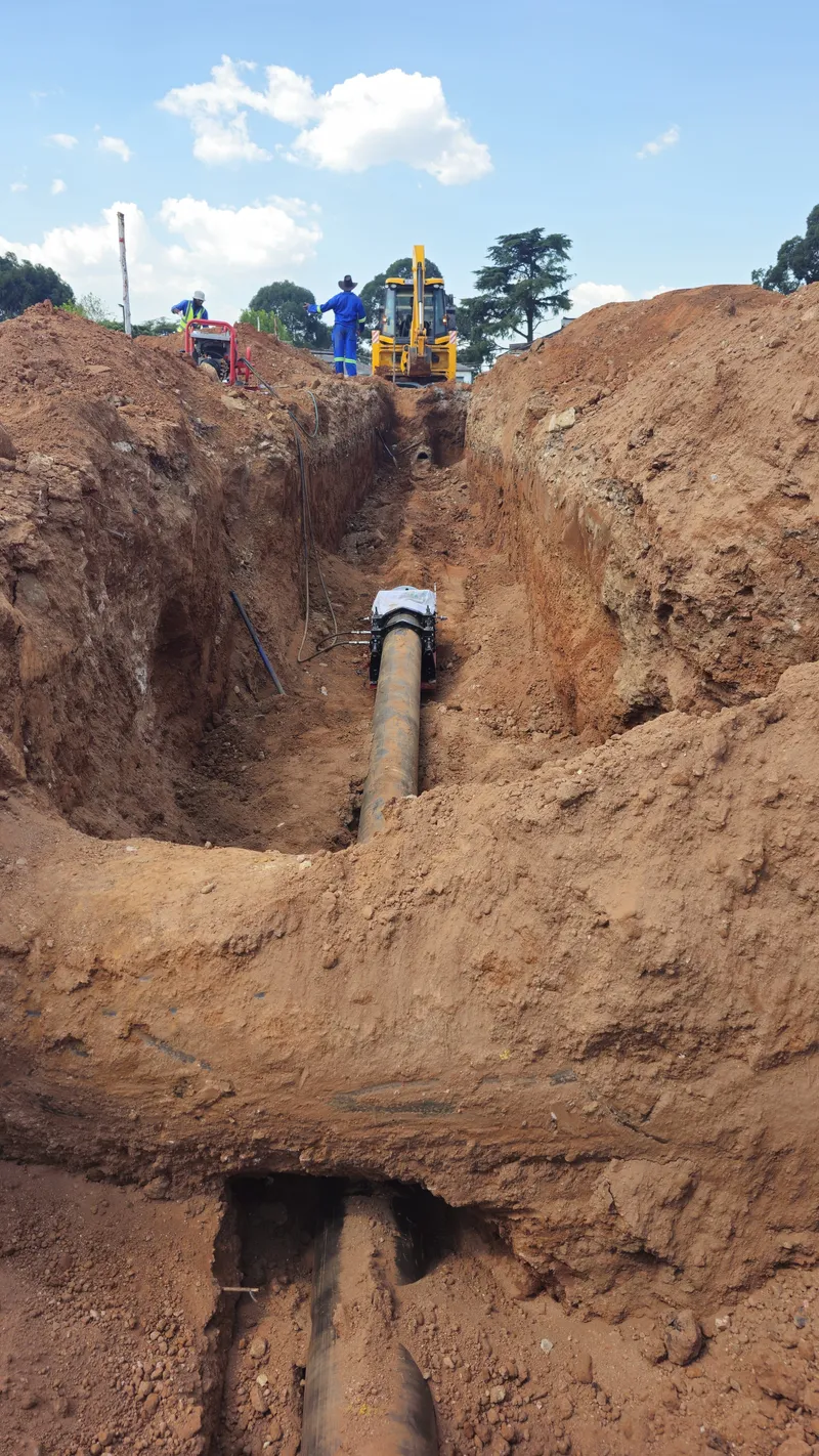 Trench with HDPE pipe ready for pullback